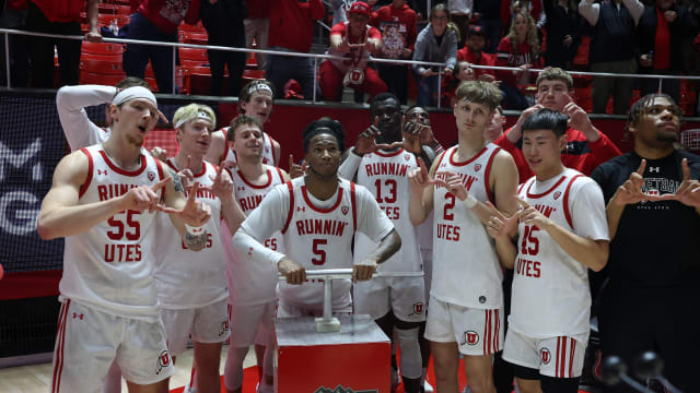 Caption: Jan 21, 2024; Salt Lake City, Utah, USA; Utah Utes guard Deivon Smith (5) Lights the U on the mountain outside of the Jon M. Huntsman Center after defeating the Oregon Ducks. Mandatory Credit: Rob Gray-USA TODAY Sports